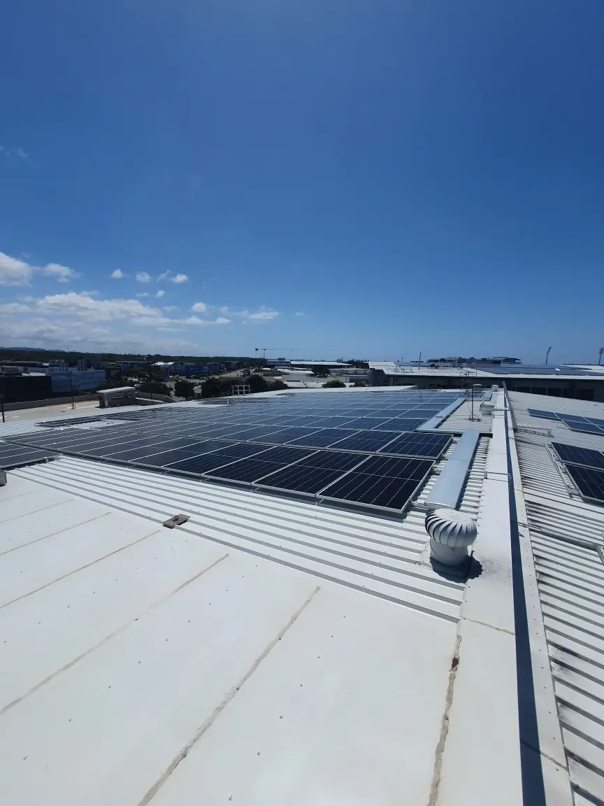 A commercial roof covered in solar panels