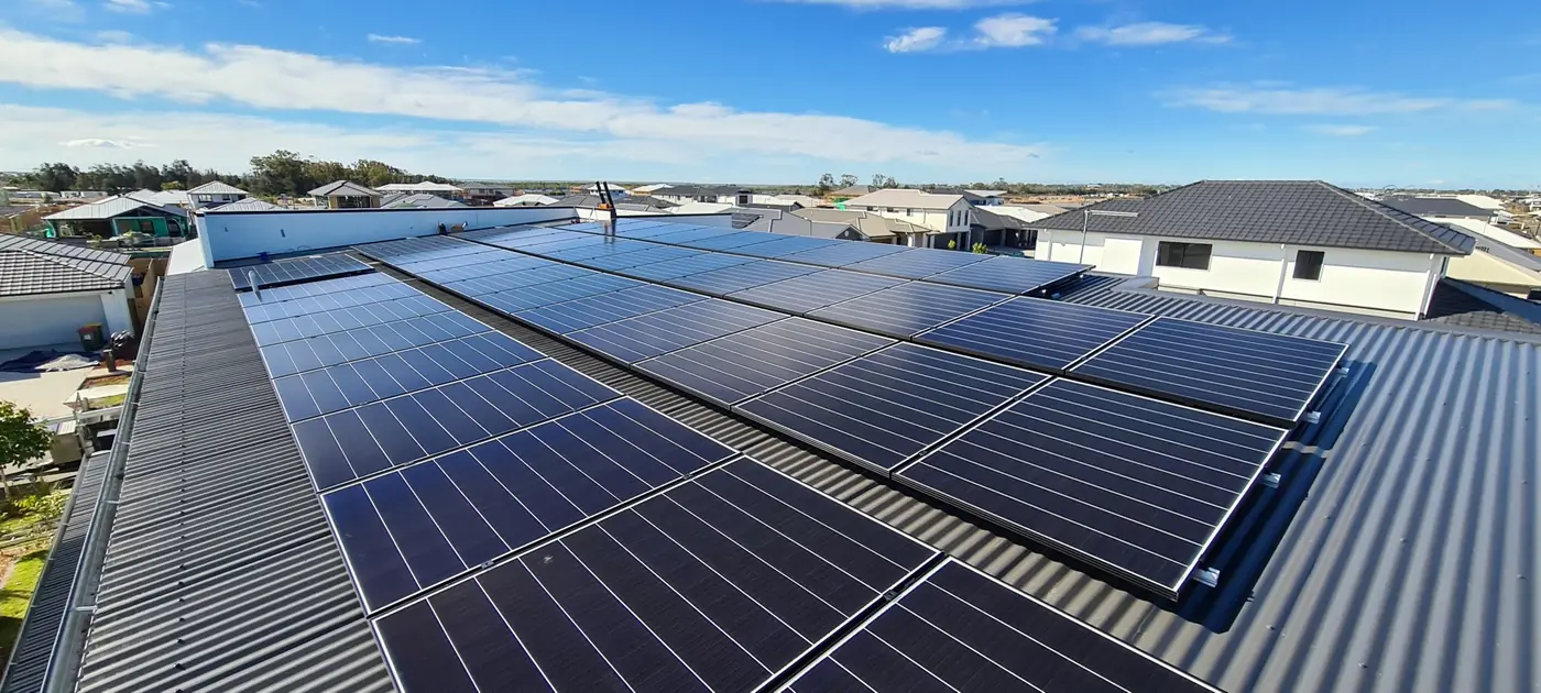 Solar panels across a metal roof in a Sunshine Coast suburb